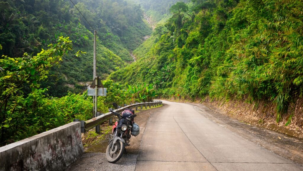 Motorbike rider on mountain road in Vietnam
