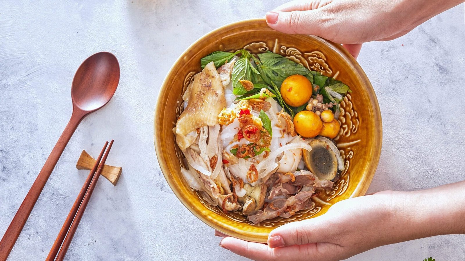 Vietnamese street food selection with pho, banh mi, and bun cha