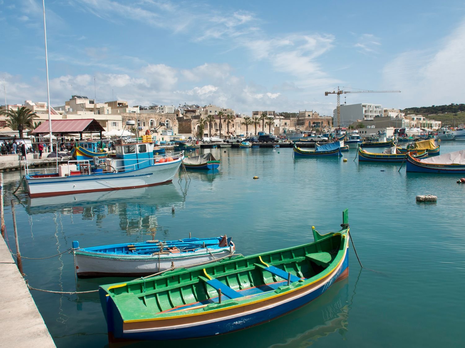 Marsaxlokk fishing village and colorful boats, Malta