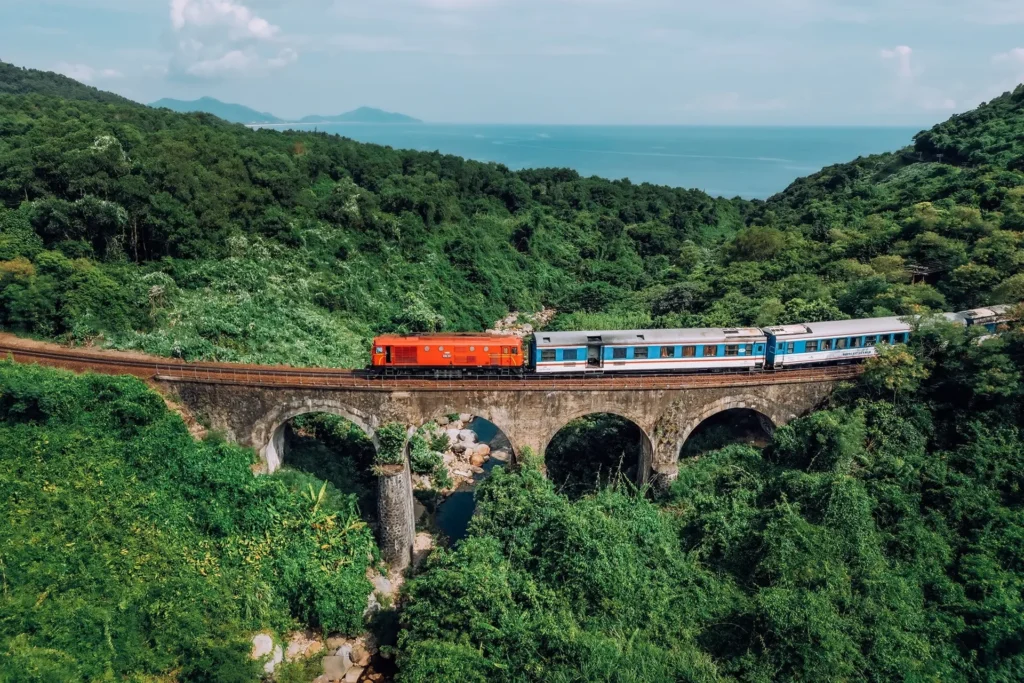 Vietnamese train passing along the coast near Da Nang
