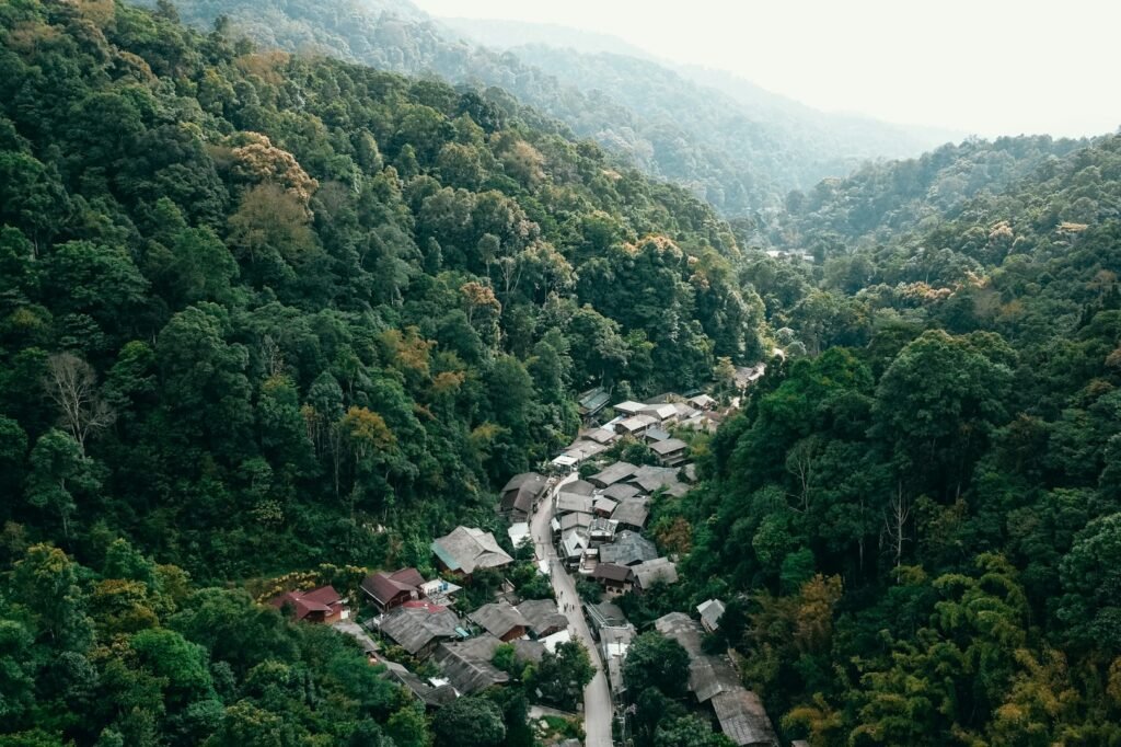 Small mountain village surrounded by forest in Northern Thailand