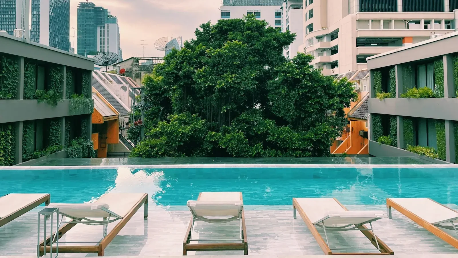 Rooftop swimming pool at a luxury hotel in Bangkok with city skyline views