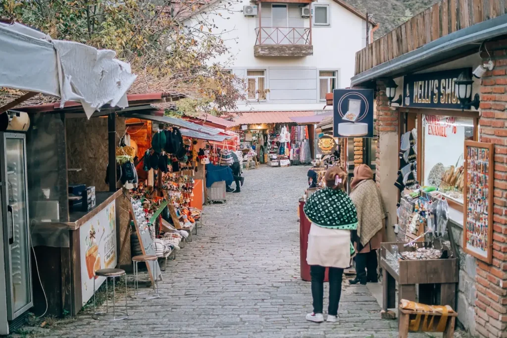 Cobblestone pedestrian street lined with souvenir shops in Mtskheta Old Town